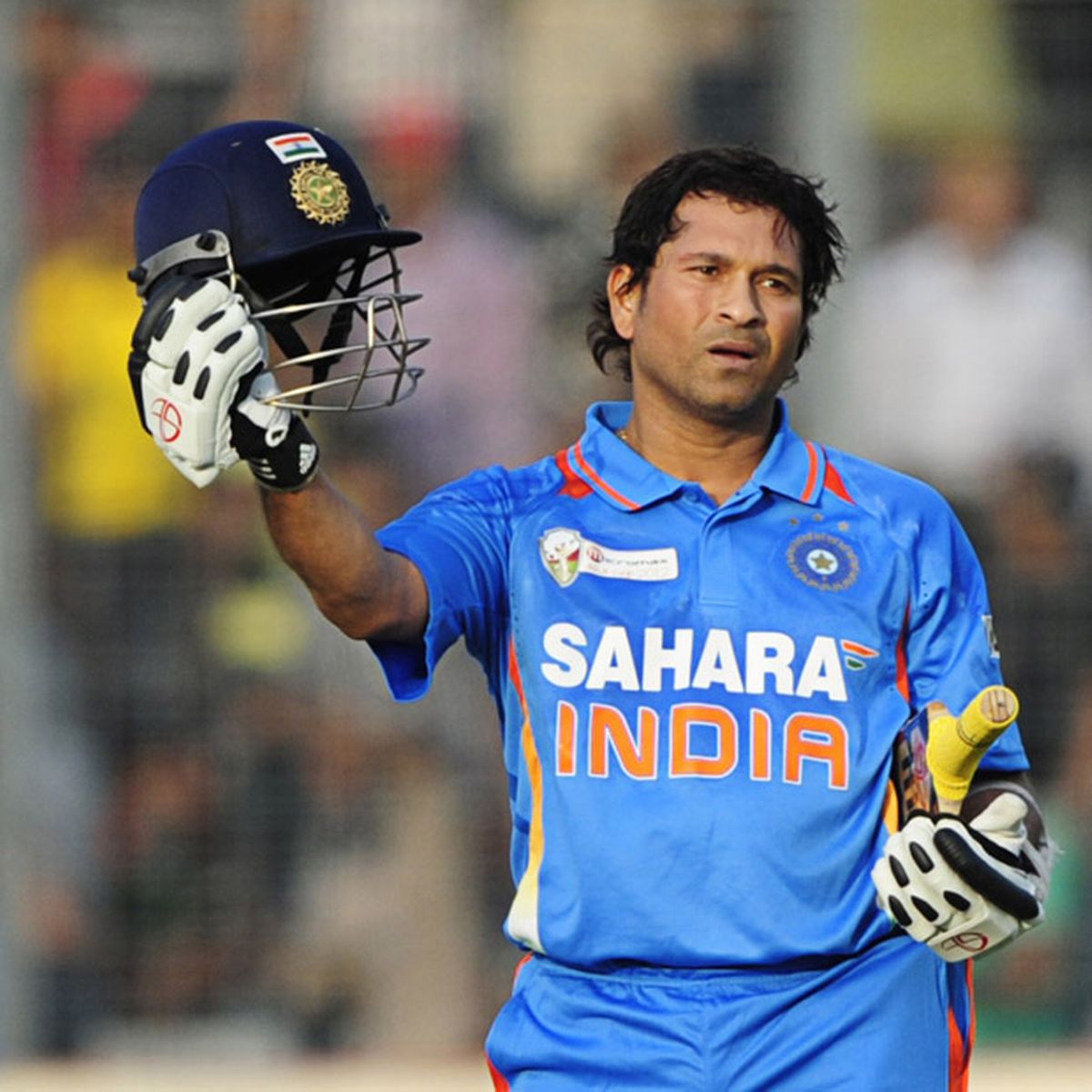 Sachin Tendulkar reacts after scoring his hundred century during the one day international Asia Cup cricket match between India and Bangladesh